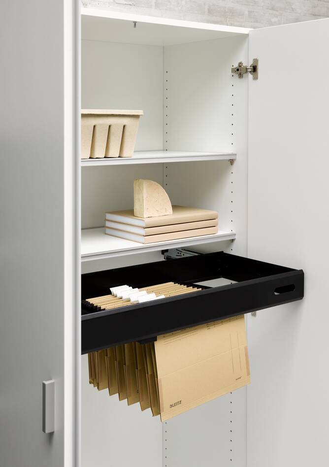 Techo Hyll cabinet in white with open doors and black pull out frame with styling front left detail view