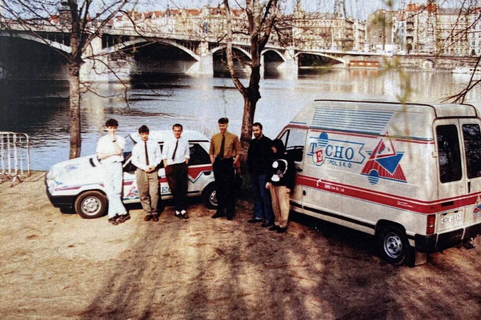 Techo founding exterior view of members with van and car in Prague