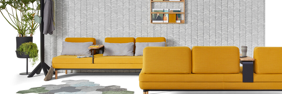 Gispen STEE sofas in black upholstered in yellow with black Dukdalf coat stand and plants front view