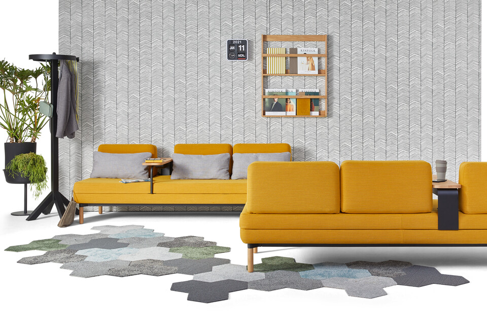 Gispen STEE sofas in black upholstered in yellow with black Dukdalf coat stand and plants front view