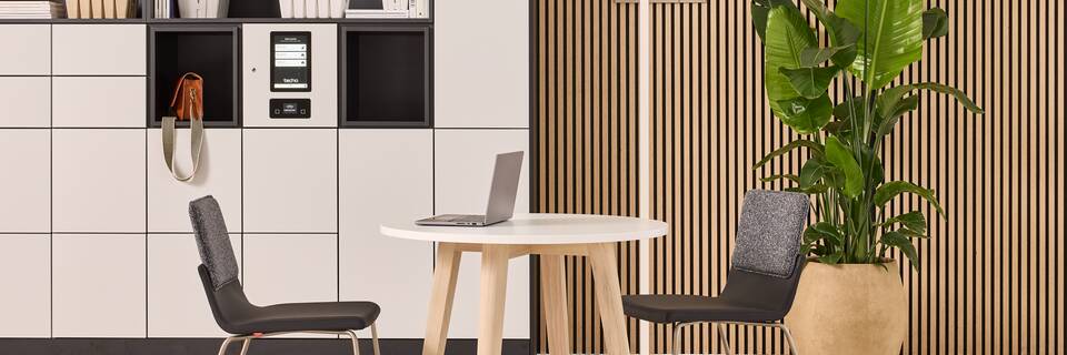 Hyll Smart Locker, Fount, Alva, Triennial Classic Techo Hyll Smart locker in grey with Fount table with Triennial Classic chair upholsterd in black and white Alva coatstand styled front view