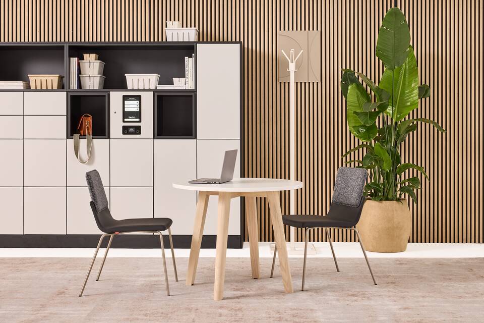 Hyll Smart Locker, Fount, Alva, Triennial Classic Techo Hyll Smart locker in grey with Fount table with Triennial Classic chair upholsterd in black and white Alva coatstand styled front view