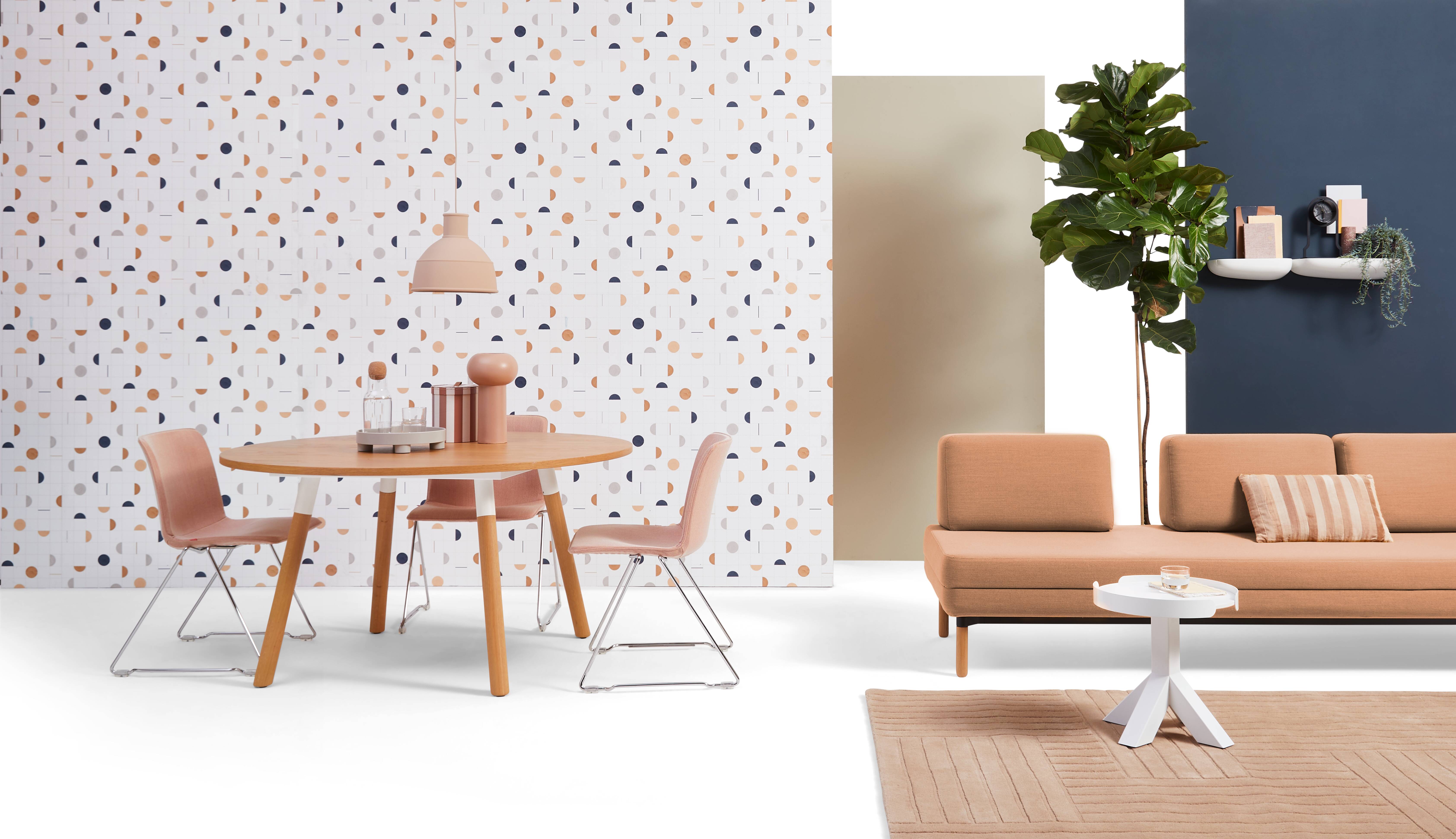 Gispen NOMI project chair with red upholstered cover and TEAM Wood round with STEE sofa in hospitality setting front view