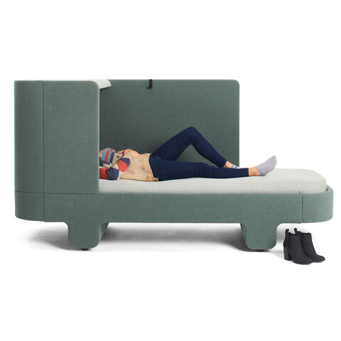 Ahrend Loungescape Powernap bed upholstered in green with female model front view