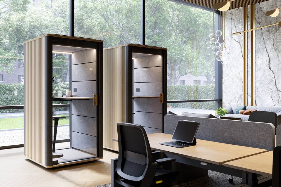 Cerene Call, Swaye, Remode, Balance, S50 Royal Ahrend Cerene Calls office pods in grey with wooden slats sides side by side and black Swaye stand aid in office space