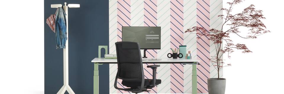 Gispen TMNL sit stand workstation with handcrank in green with white tabletop and black ZINN office chair styled with backpanels front view