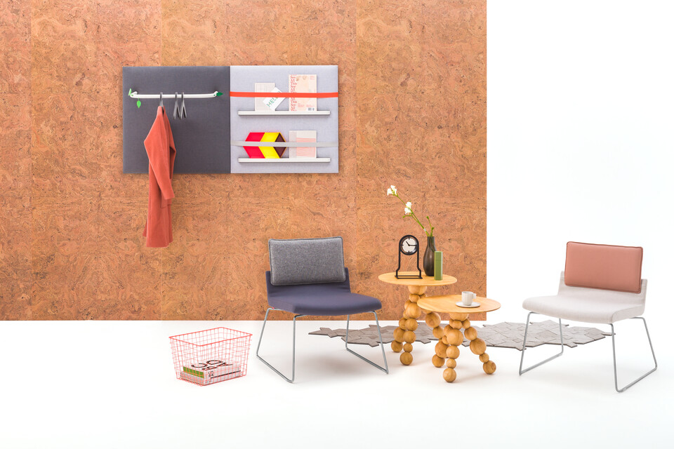 Gispen Triennial Relax chairs with Bor sidetables and Outline Clock in front of cork backpanel front view