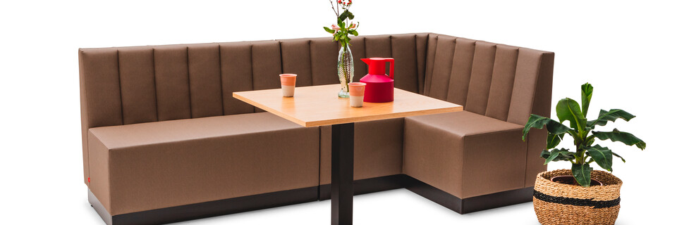 Gispen JUNA Corner and Single low trainbench upholstered in brown with black KOLM column table front left view