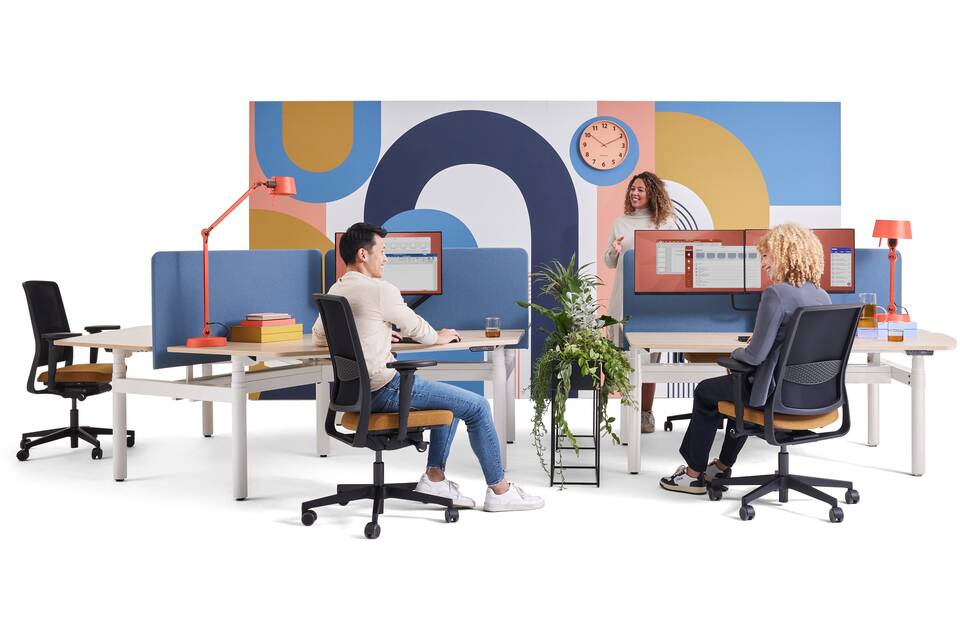 Gispen TMNL Round sit stand trio and dual workstation with oak tabletops and blue S25 screens styled with ZINN office chairs and models front view
