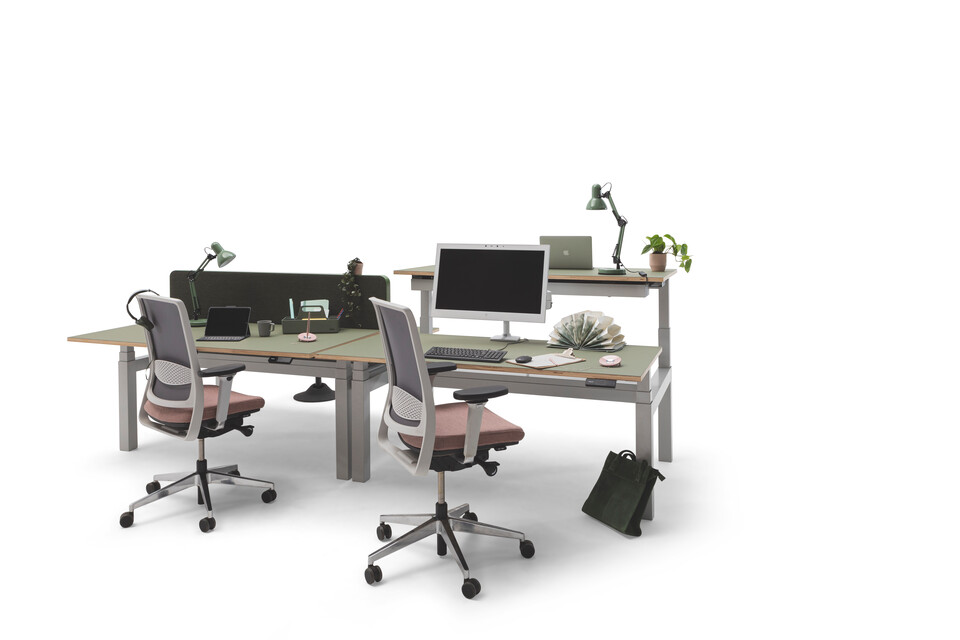 Gispen TMNL dual workstation 3 stage sit stand in light grey with green tops and green screen with Zinn office chairs front right view