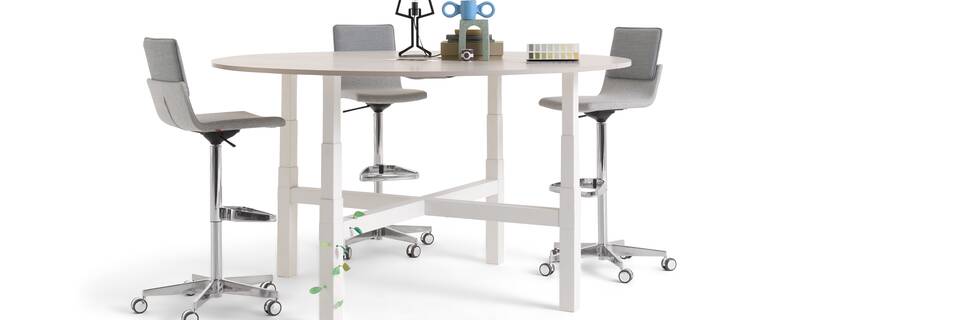 Gispen TMNL Agile 4 leg table in white with light beech tabletop in standing position with grey Triennial Work high chairs styled front right view