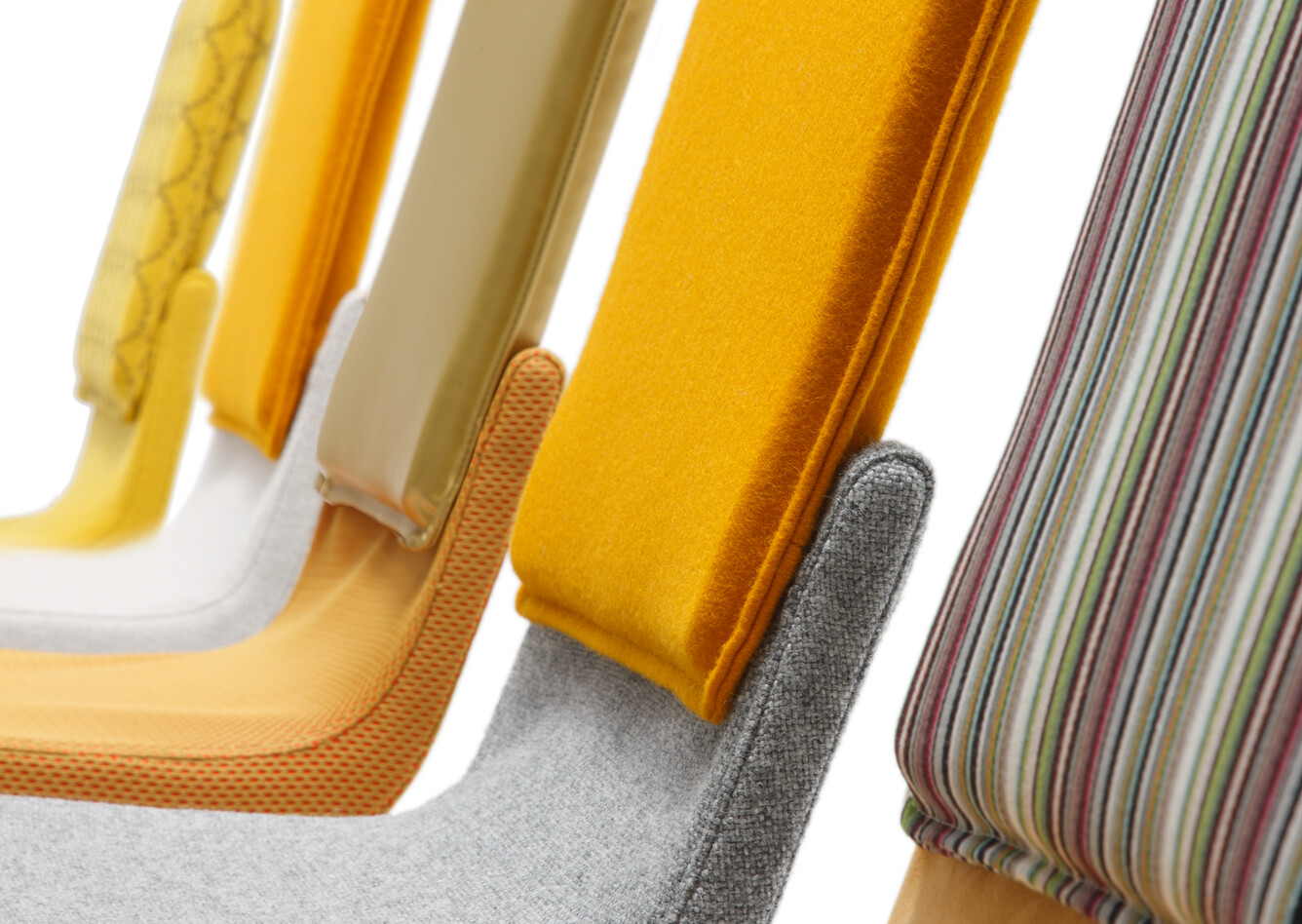 Gispen Triennial Classic chairs in various yellow and brown fabrics right side detail view