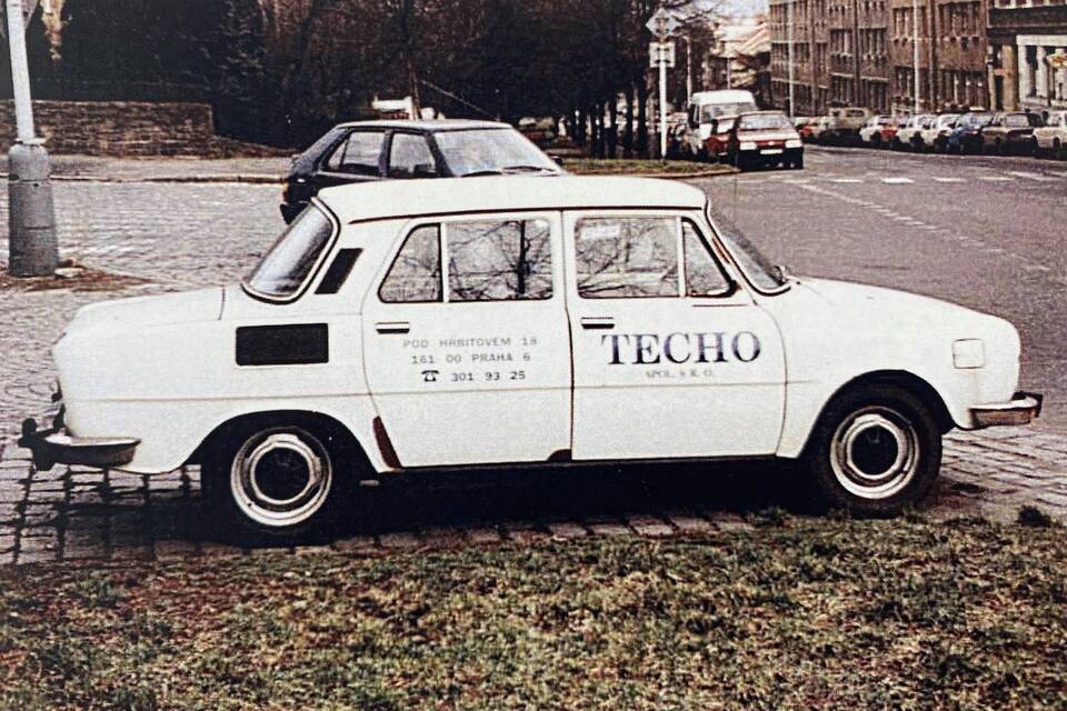 Techo Skoda 100 car with branding in streets of Prague