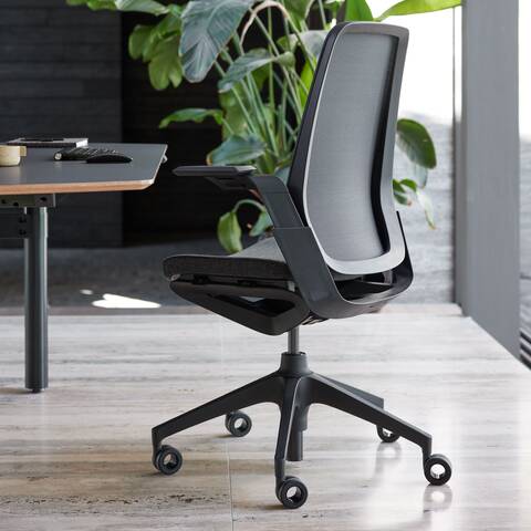 Ahrend Remode office chair in black with Modea dual workstation in a work setting right rear view