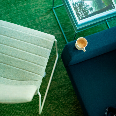 Royal Ahrend Well sled base chair fully upholstered in green at Kvadrat store in Amsterdam L1000870