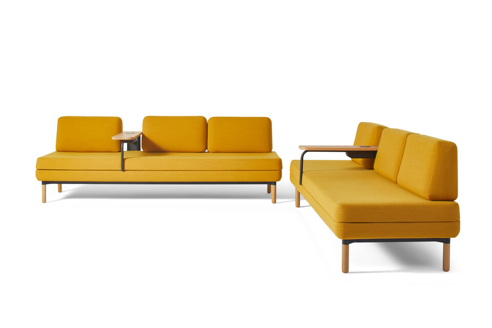 Gispen STEE sofas in black upholstered in yellow with oak tables and PuKs front and right view