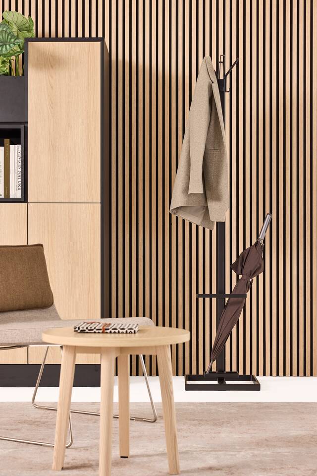 Techo Alva coatstand with umbrella stand in black with Hyll Smart locker in oak and Fount coffee table styled front view