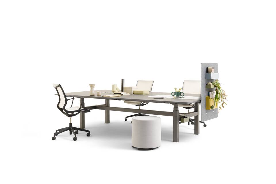 Gispen TMNL Agile table in dark grey with grey tabletop and grey felt sidepanel with Turn chair and grey Asido pouf styled front right view