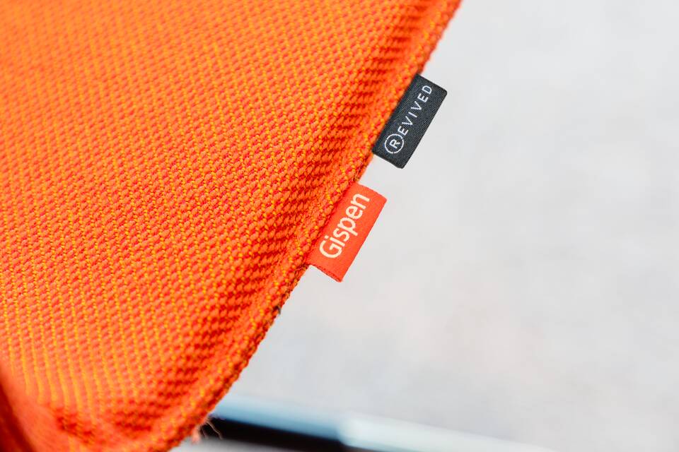 Gispen office project interior view of Rutges in De Meern with NOMI Work chair in orange left top rear detail view copy