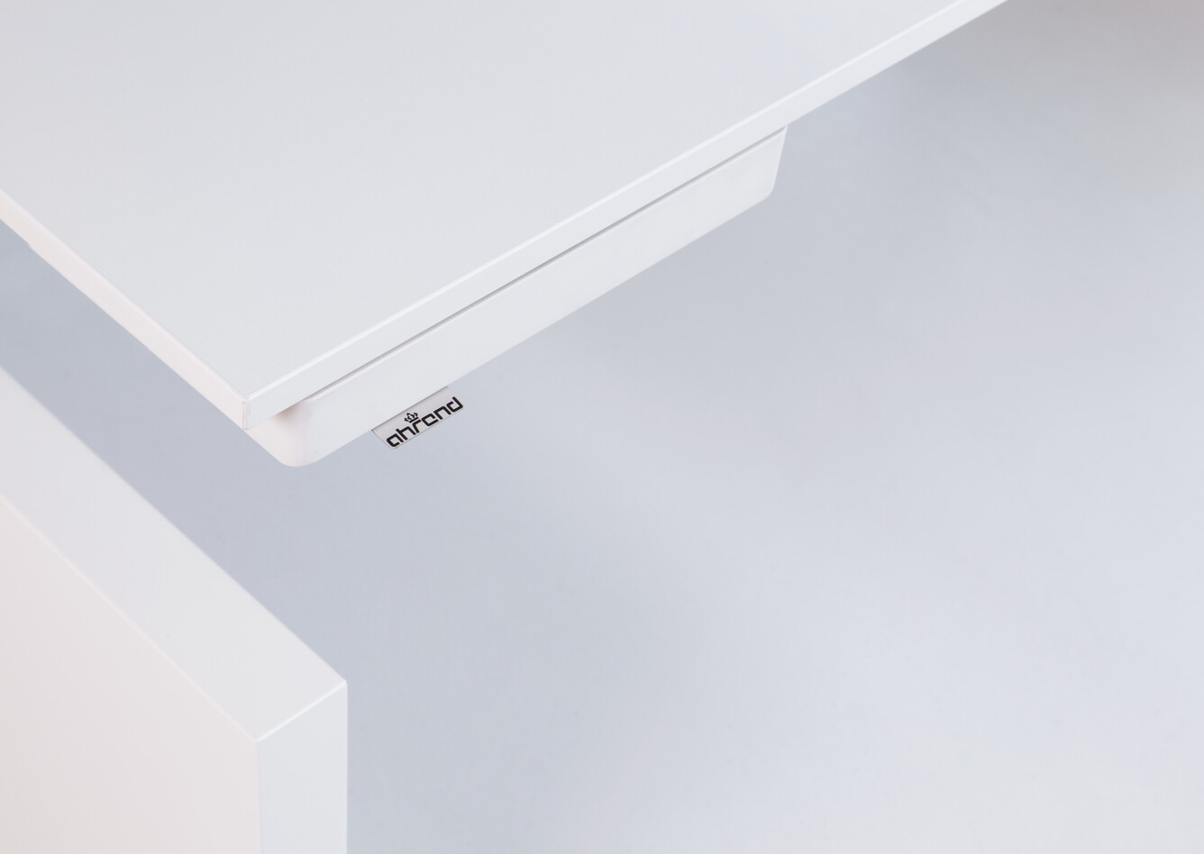 Royal Ahrend Clean desk tray in white retracted under tabletop front left view