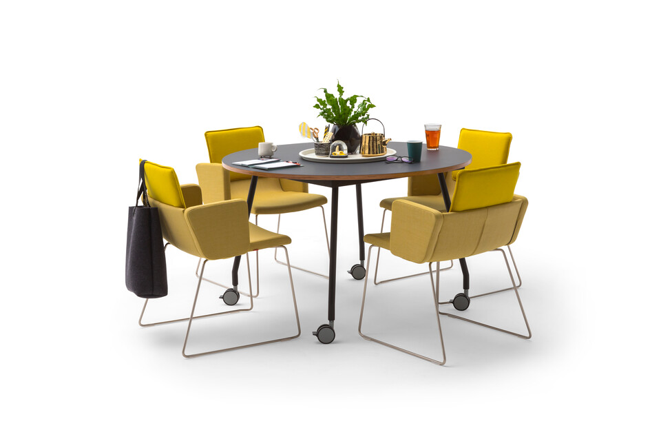 Gispen TEAM Project wheels conference table with black legs and frame and tabletop with yellow Triennial Project chairs styled front view