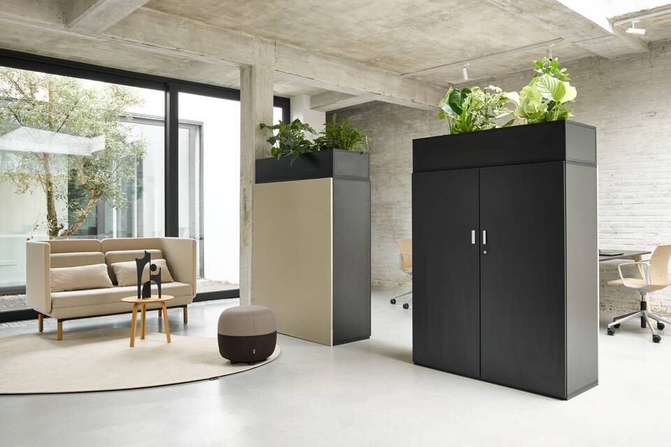 Techo Hyll cabinet in black with acoustic panel and planter and beige Charge sofa with beige brown Charge 45 pouf front right view