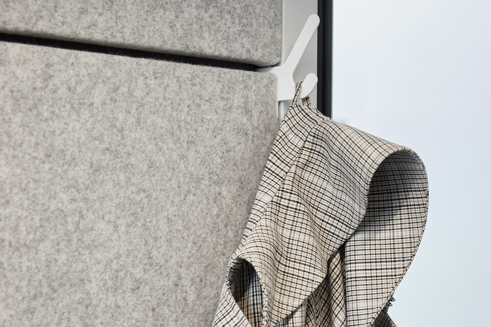 Ahrend inside of Qabin with 1x1 coathook and coat in a Hybrid working community setting