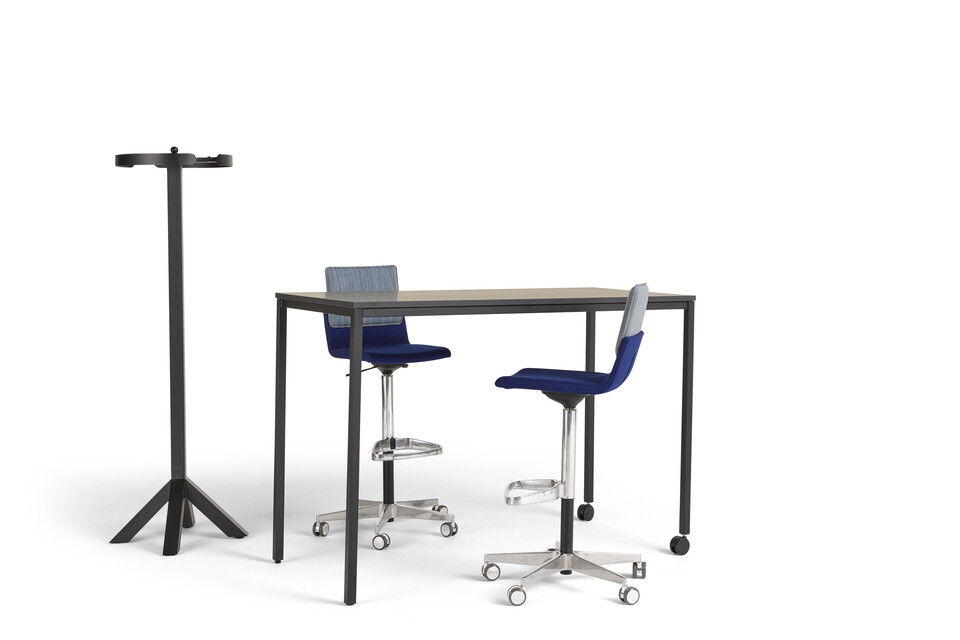 Gispen UT square 4 leg high table in black with black tabletop and castors on one side with NOMI Work high chairs front left view