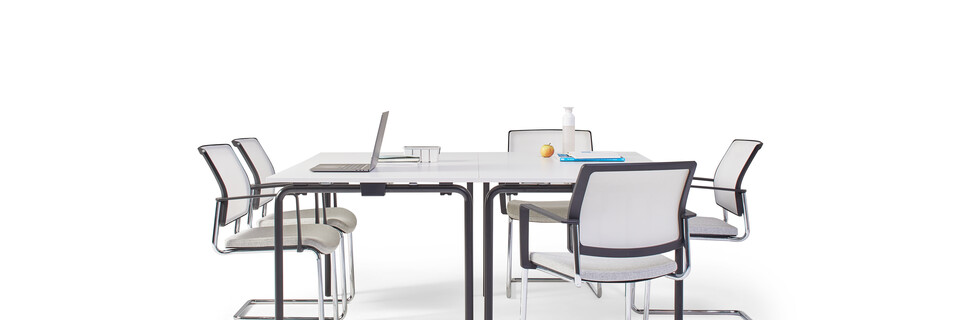 Gispen FLOO foldable tables with black legs and white tabletops styled with ZINN conference chairs right side view