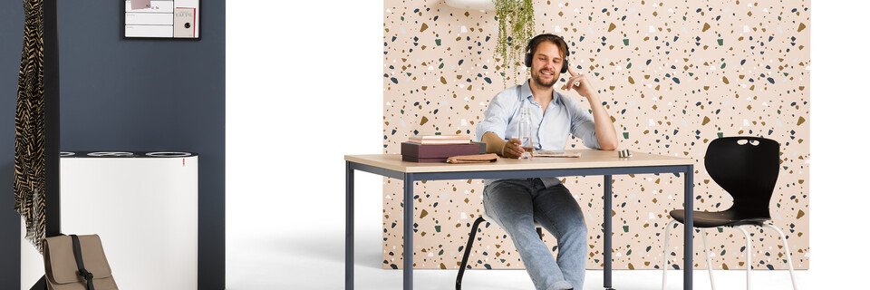 Gispen UT round 4 leg table in blue with oak tabletop on castors and EDUU chairs with model and backpanels front left view