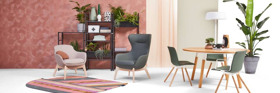 Gispen NOMI Wood chair with green upholstered cover and TEAM Wood round with Queen armchairs in care setting front view