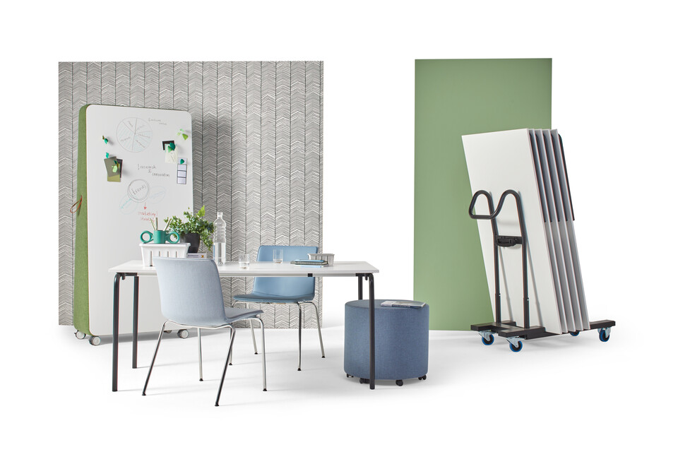 Gispen FLOO foldable table with black legs and white tabletop styled with NOMI Classic chairs and stacked tables on cart front view