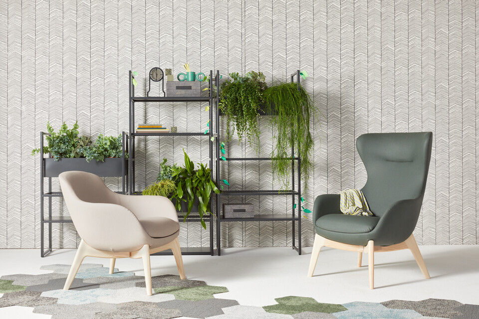 Gispen CIMO shelving unit in black with planters and Queen Low L14 armchair upholstered in beige and Queen High L14 green in front of wall front view