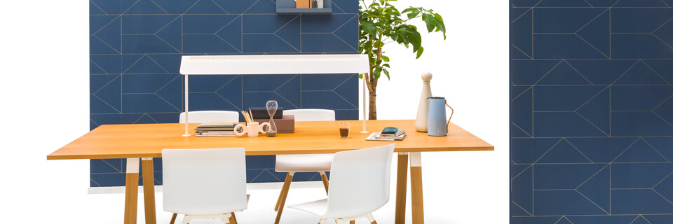 Gispen TEAM Wood rectangle conference table with diagonal oak legs and tabletop with white Nomi Wood chairs and blue backpanels front view