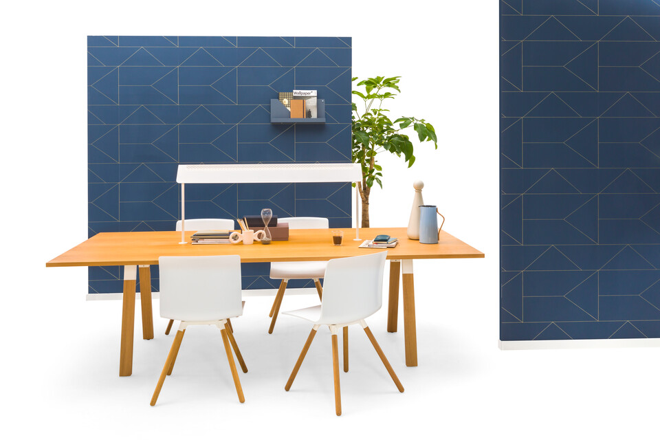 Gispen TEAM Wood rectangle conference table with diagonal oak legs and tabletop with white Nomi Wood chairs and blue backpanels front view