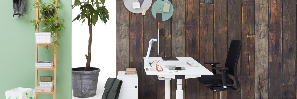 Gispen TM workstation in white with white tabletop and black upholstered black Zinn office chair in front of brown wooden backpanel left side view