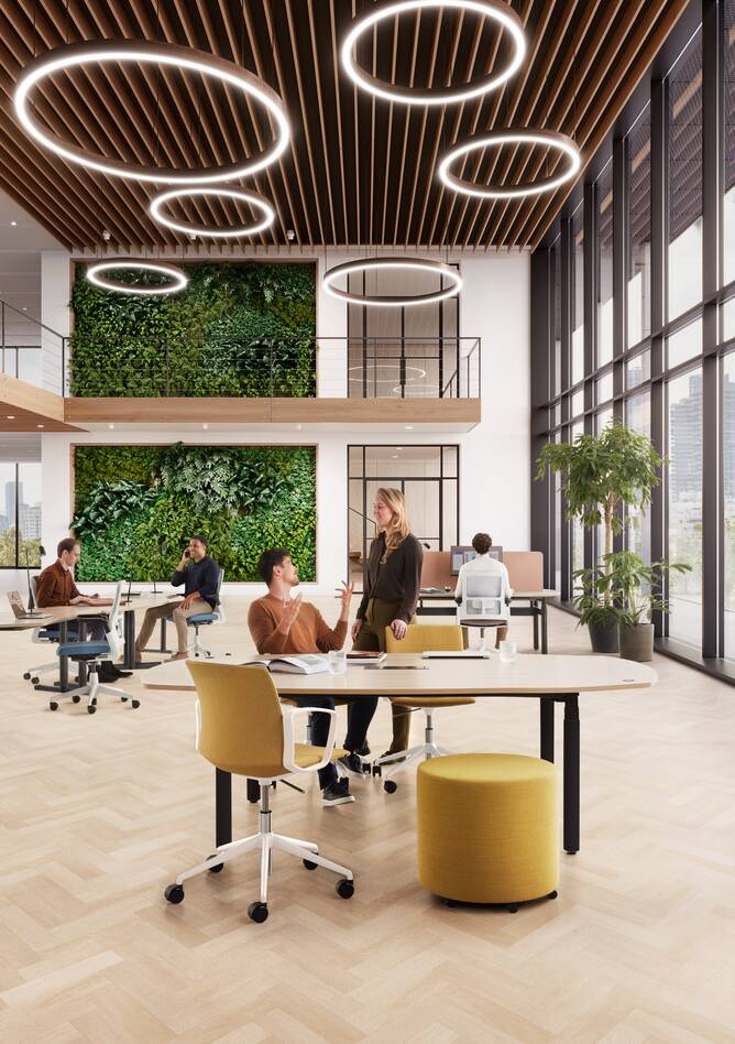 Ahrend Modea sit stand conference table in black with oak barrel tabletop with sitting and standing models in a vitalising workspace interior view