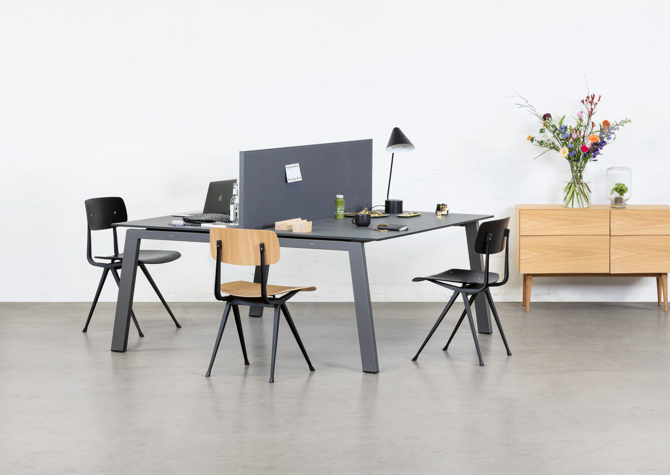 Royal Ahrend Balance 4 leg dual workstation in anthracite with charcoal tops and grey screen with Result chairs front left view
