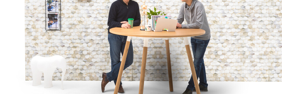 Gispen TEAM Wood round high conference table with oak legs and white frame and tabletop with Low Res Elephant and Beehive backpanel front view