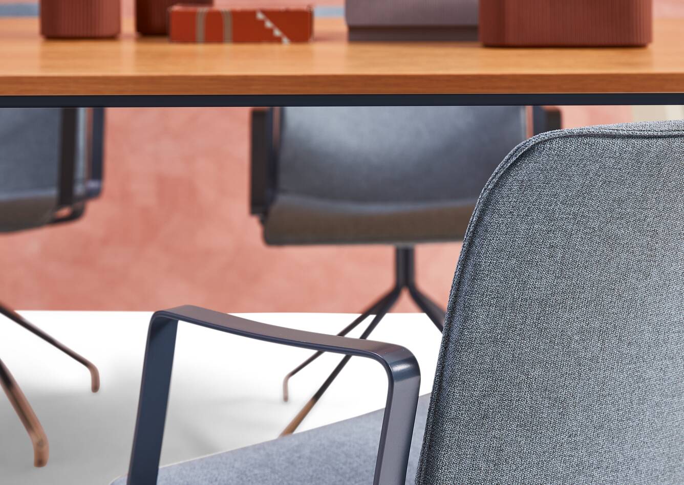 Gispen NOMI Work in blue with armrests and blue upholstered cover in front of TEAM Wood rectangle table styled right rear detail view