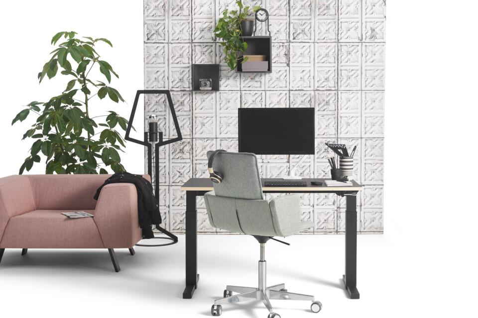 Gispen TMNL workstation in black with Triennial Manage chair upholstered in green and SETT armchair upholstered in pink with concrete backpanel front view