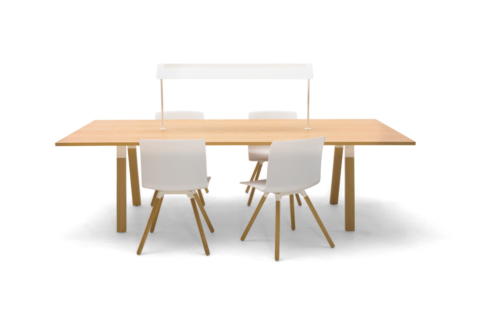 Gispen TEAM Wood rectangle conference table with diagonal oak legs and tabletop with white Nomi Wood chairs front view