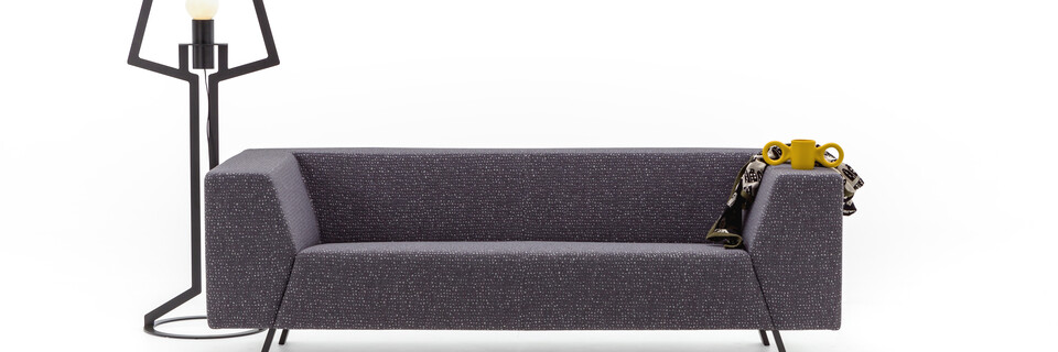 Gispen Sett low 3 seat sofa in galaxy 178 anthracite with Oultine floorlamp and dombo cup front view