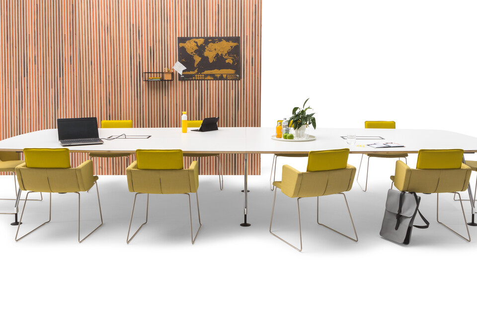 Gispen TEAM Project conference table with chrome legs and black frame with white tabletop with yellow Triennial Project chairs and scrapwood backpanel front view