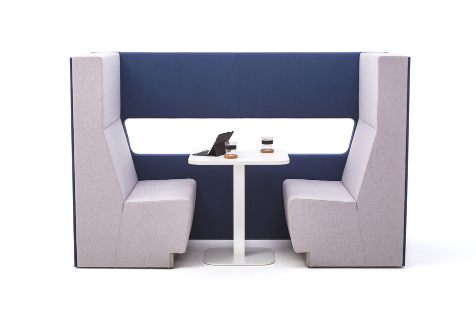 Gispen MultiLounge alcove setup with blue connecting wall and pink grey seating with white KOLM Column square table and tablet side view