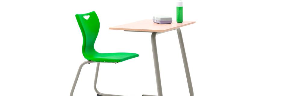 Gispen Eduu Comfort table and chair with grey frame and beech grey tabletop with styling front left view