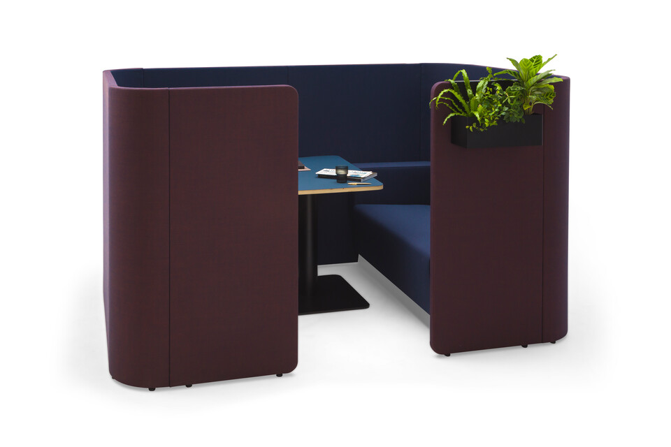 Gispen HUGG Duo couch XL upholstered in blue and black table and planters front left view