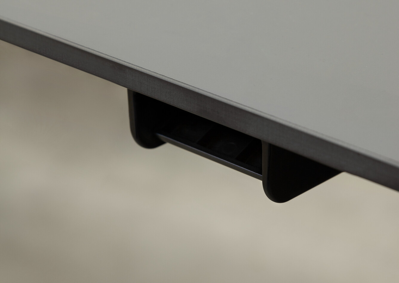 Royal Ahrend Balance Lift workstation in grey with charcoal top and lift adjustment front right top detail view