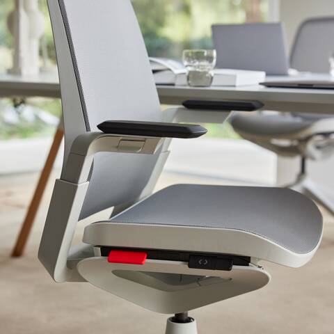 Ahrend Remode office chair in grey with lumbar support close up of height adjustment front left view