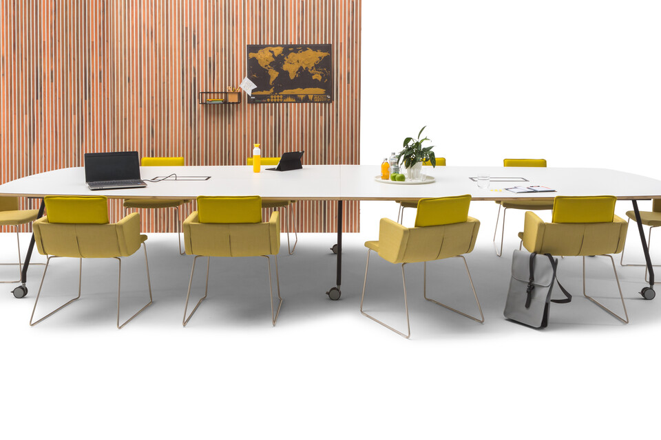 Gispen TEAM Project wheels conference table with black legs and frame with white tabletop with yellow Triennial Project chairs and scrapwood backpanel front view